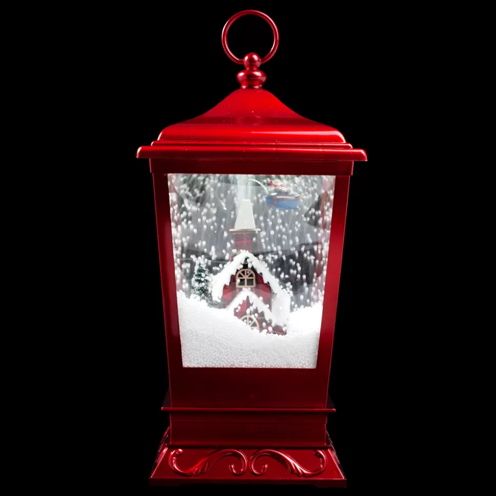 Christmas Forever LANTERN WITH HOUSE & SANTA ON PLANE SNOWING SCENE 15.75″